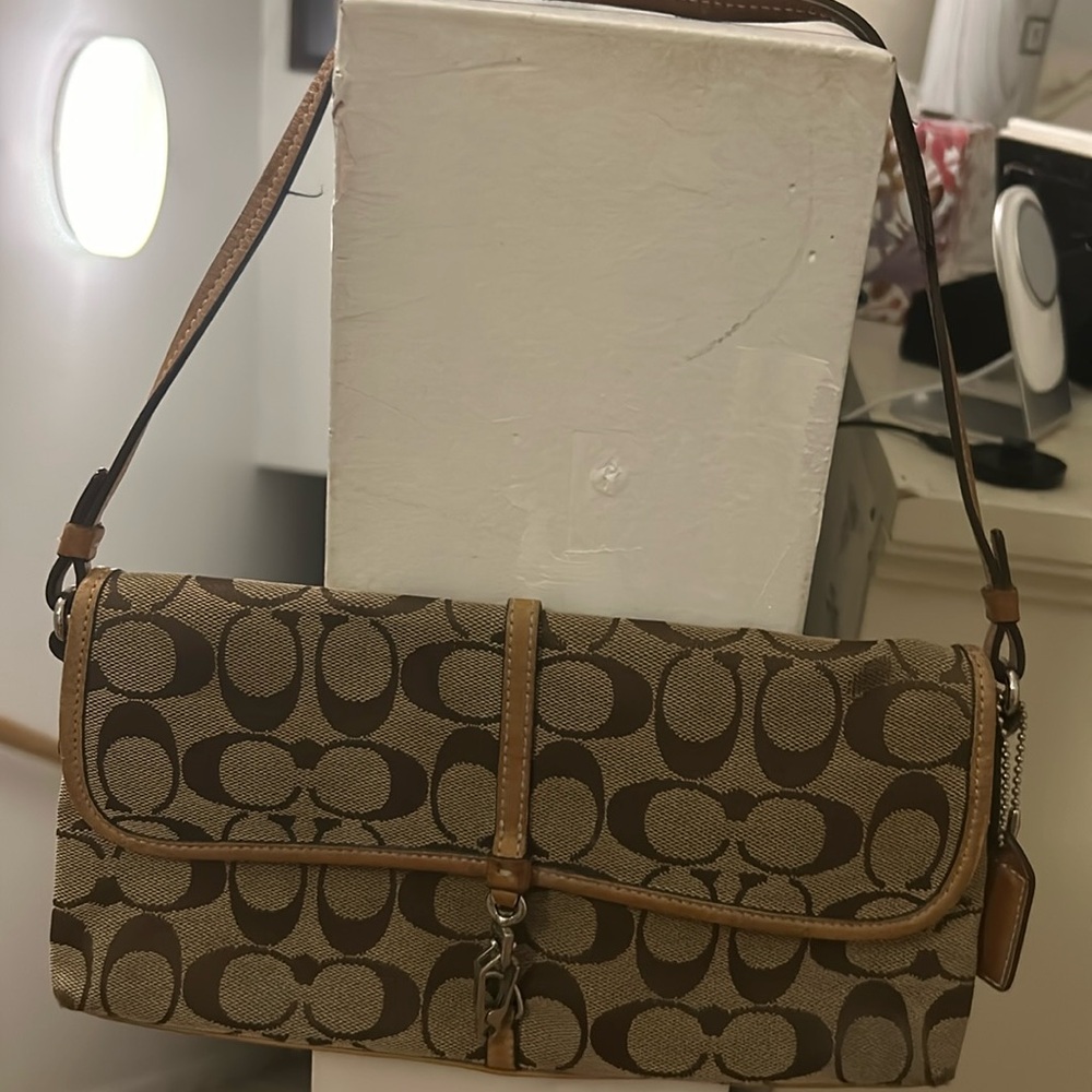 Coach vintage bag from ‘02. Good condition a few wear marks. Canvas and leather